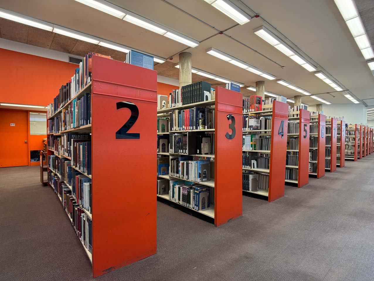 Library book shelves Photo of red numbered Library book shelves