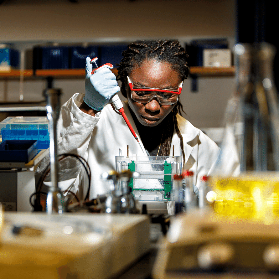 FEMALE STUDENT IN A SCIENCE LAB